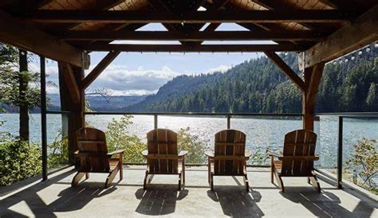 Adirondack chairs under the pavilion facing Suttle Lake
